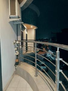 a balcony of a building with a view of a boat at 2 Bedroom Luxury Apartment in Dakar