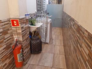 a room with a heater and a fire hydrant at Casa Da Vovó Helena in Vila Velha