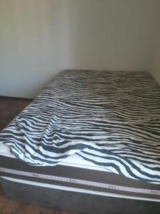 Ένα ή περισσότερα κρεβάτια σε δωμάτιο στο Apartamento Condominio Vila Suiça