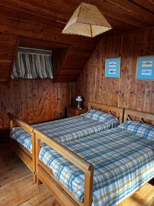 Postel nebo postele na pokoji v ubytování Tres Amapolas Llao Llao + 14 fotografií