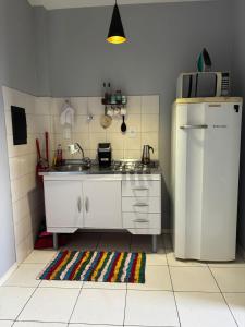 Kuchyň nebo kuchyňský kout v ubytování Loft funcional no centro!