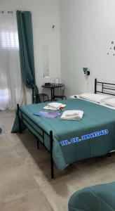 Postel nebo postele na pokoji v ubytování Falaride suite Agrigento discesa sulla valle di oro