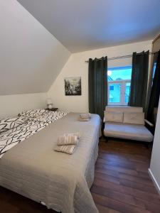 a bedroom with a large bed and a window at Top apartment with a view in Tromsø +42 photos