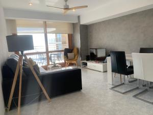 Televízia a/alebo spoločenská miestnosť v ubytovaní Apartamento Jaume II Palamós