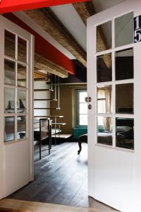 an open door into a room with a living room at Appartements Au-Dessus Du... in Strasbourg