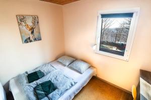 A bed or beds in a room at Molnárkalács vendégház