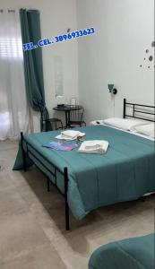 Postel nebo postele na pokoji v ubytování Falaride suite Agrigento discesa sulla valle di oro