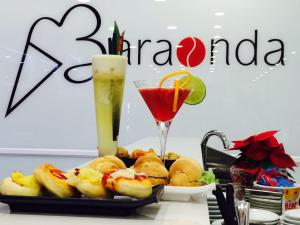 a tray of food and a drink on a table at B&b Torre del Greco in Torre del Greco