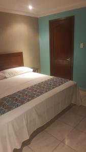 Postel nebo postele na pokoji v ubytování Villas y Suites 304