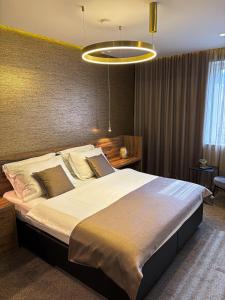 a bedroom with a large bed in a room at Calma Luxury Rooms in Split