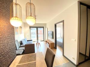 a living room with a couch and a table at Apartimento Vespa2 in Wrocław