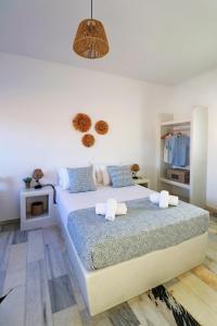 Posteľ alebo postele v izbe v ubytovaní Sunny Studios Naxos
