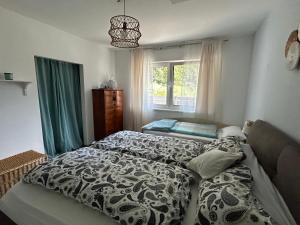 a bedroom with a bed and a window at Ferienhaus Mölltal in Penk +26 photos