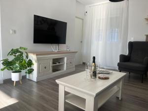 TV a/nebo společenská místnost v ubytování Casa Alpha
