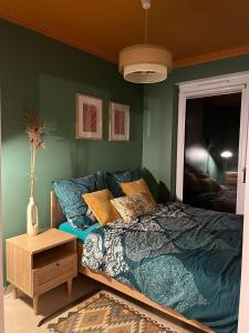 Postel nebo postele na pokoji v ubytování Bursztynowy Apartament