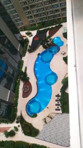 Πισίνα στο ή κοντά στο Apartemen Grand Jati Junction