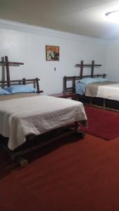 Postel nebo postele na pokoji v ubytování Hotel Rincón Paraíso