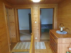 a room with two doors and a dresser in a cabin at Haus Bachrauschen in Kirchanschöring +41 photos