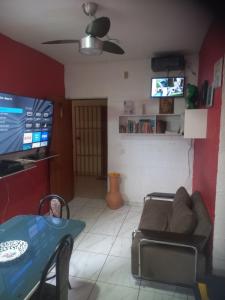 a living room with a couch and a table at Pousada Victor - Arte in Manaus