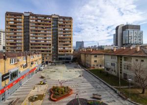 an aerial view of a city with buildings at Heart of the City - Free Parking in Pristina