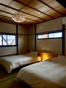 Postel nebo postele na pokoji v ubytování Ippo Nozawa 一歩 野沢温泉 + 6 fotografií