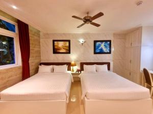 Postelja oz. postelje v sobi nastanitve Tulip Hotel 3