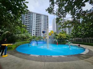 a playground with a water park in a city at SplashMania homestay Gamuda Cove in Banting