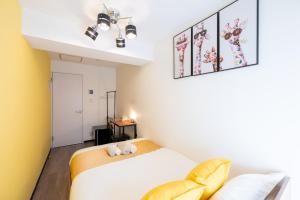 Ένα ή περισσότερα κρεβάτια σε δωμάτιο στο 新宿駅まで12分渋谷駅まで22分最大8名様宿泊可能4ベッドルーム