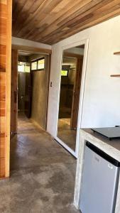 a hallway of a house with a door open at Cabina Tropically in Santa Cruz