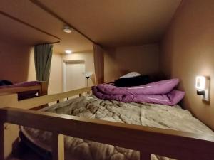 Postel nebo postele na pokoji v ubytování aouei