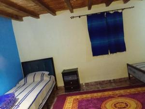 A bed or beds in a room at Dar zitouna
