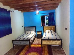 A bed or beds in a room at Dar zitouna