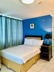 Postel nebo postele na pokoji v ubytování WJV Premium Hotel