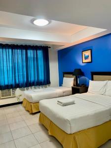 Postel nebo postele na pokoji v ubytování WJV Premium Hotel
