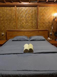 Serenity Lodge Tetebatu Lombok客房内的一张或多张床位