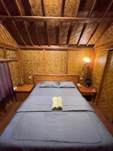 Serenity Lodge Tetebatu Lombok客房内的一张或多张床位