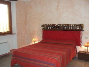 Letto o letti in una camera di Agriturismo QuartoPodere