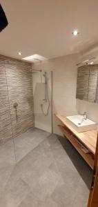 a bathroom with a sink and a shower at Ferienwohnung Christina in Ried im Zillertal