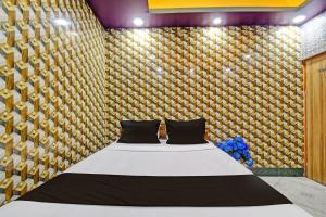 Postel nebo postele na pokoji v ubytování Hotel O Mohona Residency & Restaurant + 23 fotografií