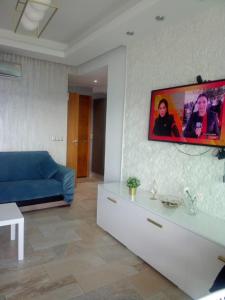 AppartF3 vue panoramique sur mer Residence Vista Del Mar TV 또는 엔터테인먼트 센터