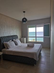 AppartF3 vue panoramique sur mer Residence Vista Del Mar 객실 침대