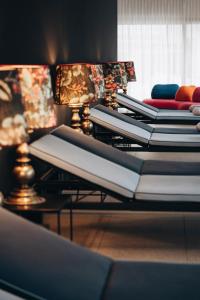 a row of mattresses are lined up on a table at Appart Hotel Knappaboda in Lech am Arlberg +128 photos