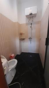 Vannituba majutusasutuses Aditya Homestay