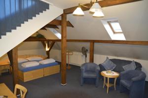 Postel nebo postele na pokoji v ubytování Hotel Zlaty Lev