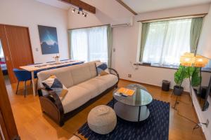 Letto o letti in una camera di Le Nessa Akazawa