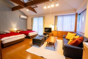 Letto o letti in una camera di Le Nessa Akazawa