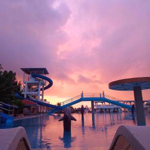 a person in the water at a water park at Nassim Hotel and Beach Resort in Casagan