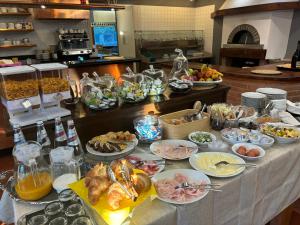 a buffet with many different types of food on a table at Il Ghebo in Cavallino-Treporti