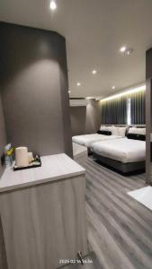 Voodi või voodid majutusasutuse Jiati Business Motel toas