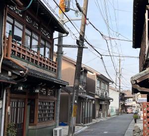 an alley in an asian city with buildings at Kyoto House in Yamazaki
